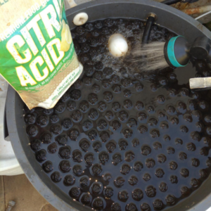 Tub full of product with bag of Halefresh citric acid.